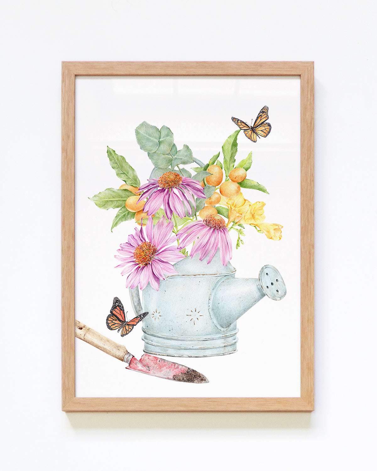 Framed art print featuring a vintage watering can filled with echinacea flowers, kumquats, eucalyptus leaves, and surrounded by monarch butterflies, perfect for farmhouse kitchen decor.