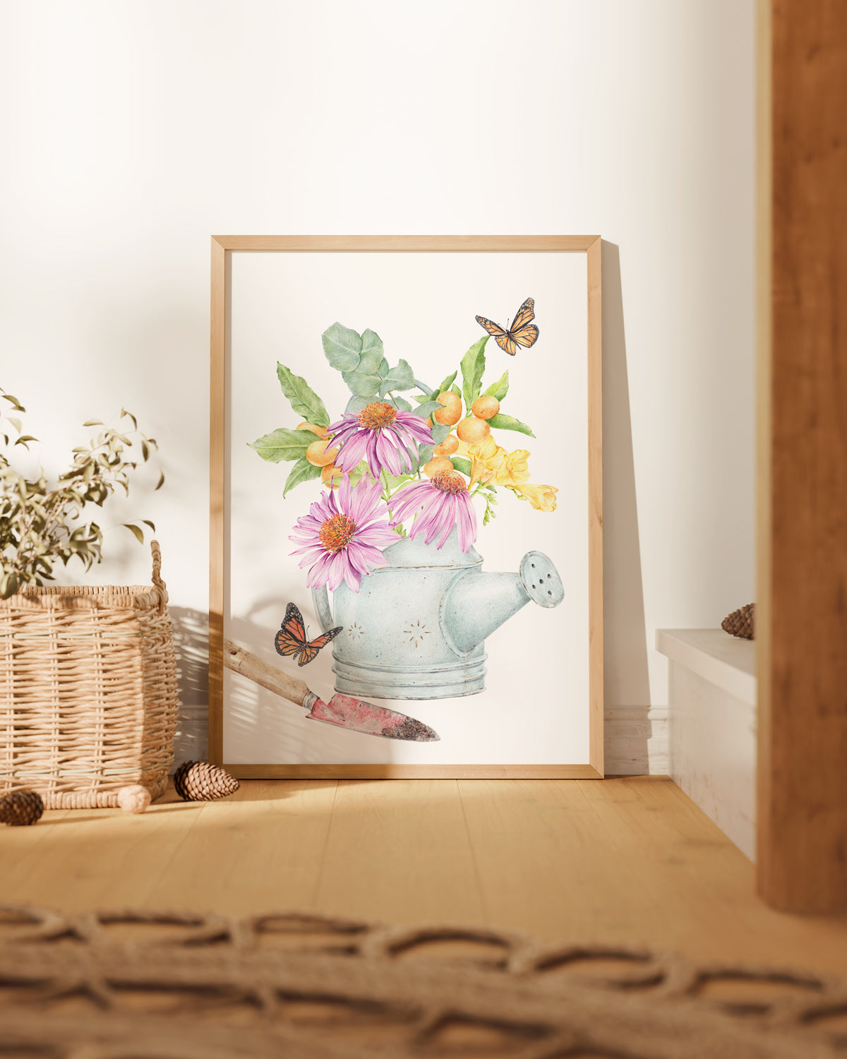 Art print featuring a vintage watering can filled with echinacea flowers, kumquats, eucalyptus leaves, and surrounded by monarch butterflies, perfect for farmhouse decor.